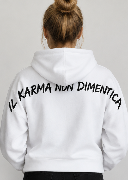 Back view of a person wearing a white SERITEX DI SALA SHOP hoodie with 'IL KARMA NON DIMENTICA' text.